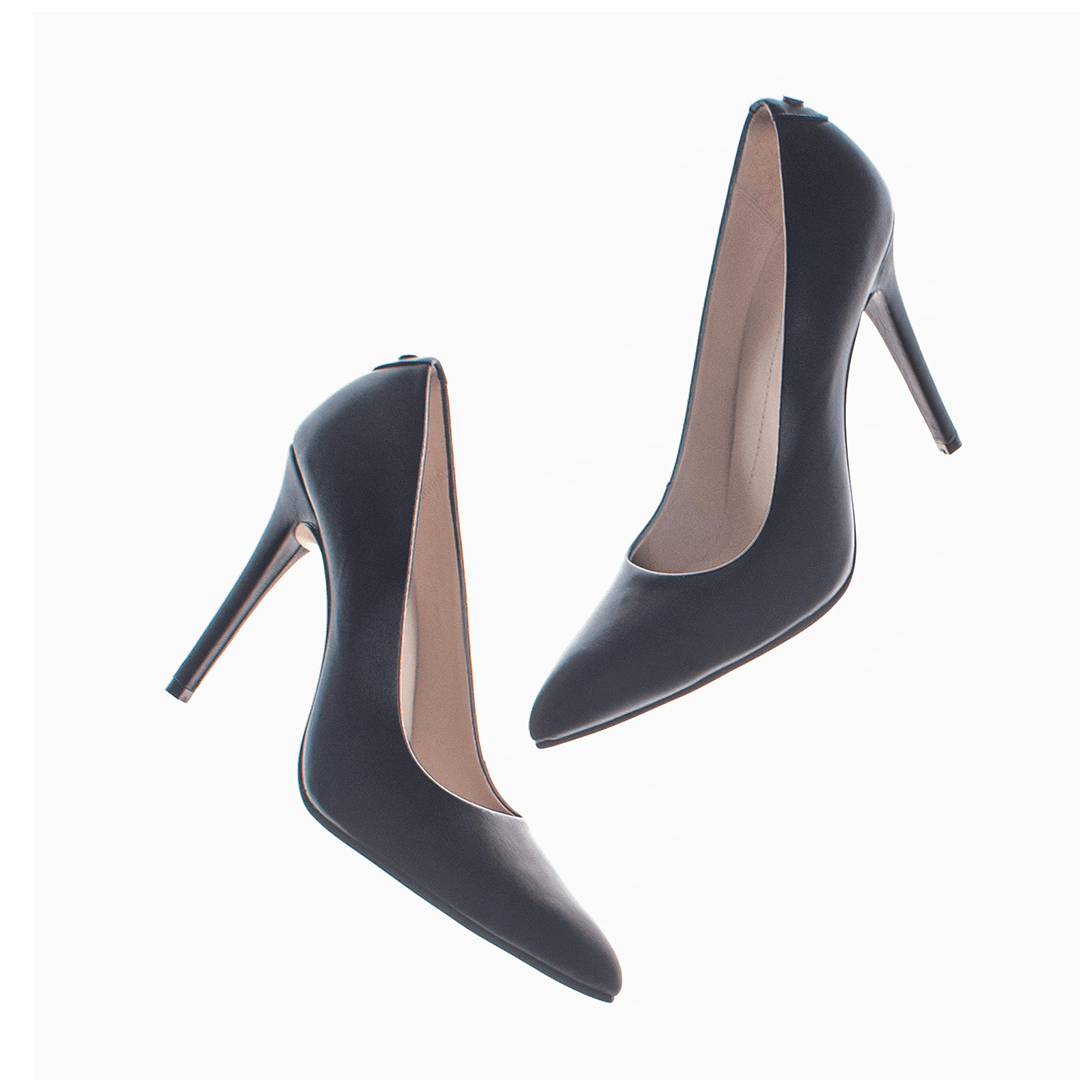 Pair of black pointed-toe pumps on a white product background