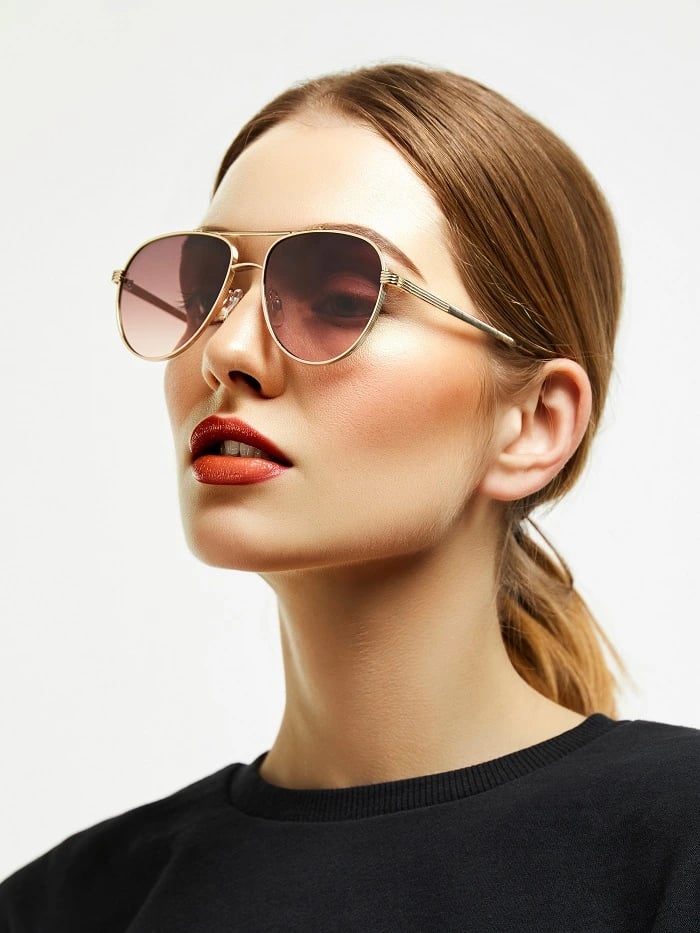 Portrait with tied-back hair and sunglasses